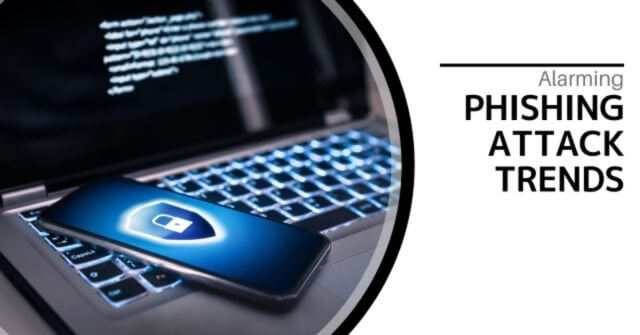 Smartphone with a lock on the screen sitting on they keyboard of an illuminated laptop. Text reads, "Alarming Phishing Attack Trends"